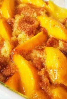 Homemade easy peach cobbler with fresh peaches served in a baking dish