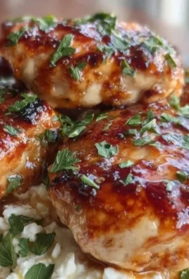 Delicious hot honey feta chicken served on a plate with herbs