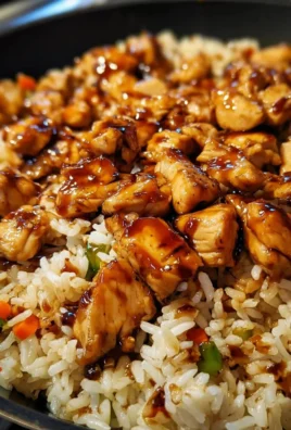 One-Pan Honey BBQ Chicken Rice dish garnished with fresh herbs and served in a skillet.