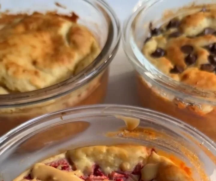 Fluffy baked protein pancake bowls topped with fruits and syrup
