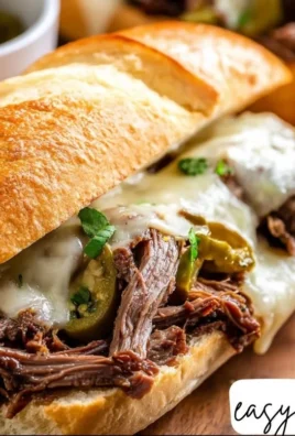 Slow Cooker Mississippi Pot Roast Sandwich ready to enjoy on a plate.