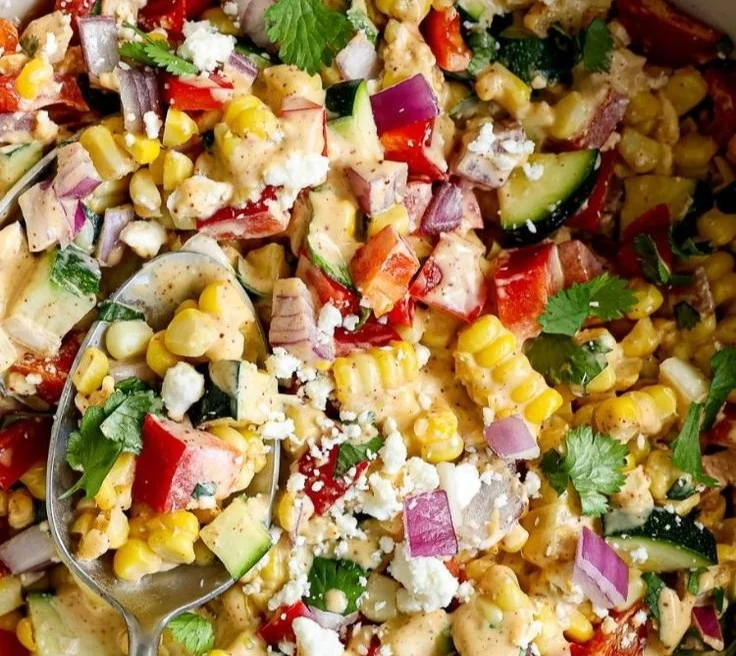 Fresh Zucchini Corn Salad with colorful vegetables in a serving bowl